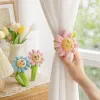 Pink and blue flower-shaped plush curtains with smiling face expressions and green stems and leaves details Picture